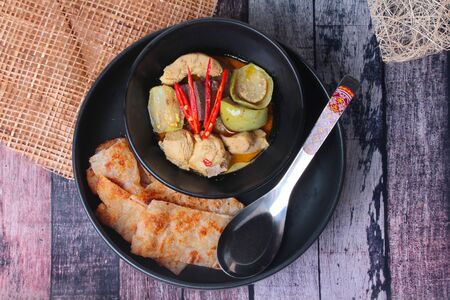 Ready served of Roti , Indian food as deep fried flour ,with Thai green curry isolated on background.の写真素材