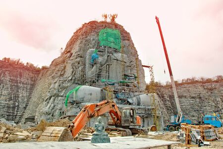 Buddha master the front and the outdoor stone carving and plaster for the construction of the Buddha statue .の写真素材