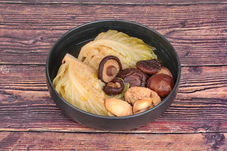 Streamed  gourd  wrap vermicelli ,shiitake mushrooms and minced chicken in Chinese bone soupの写真素材