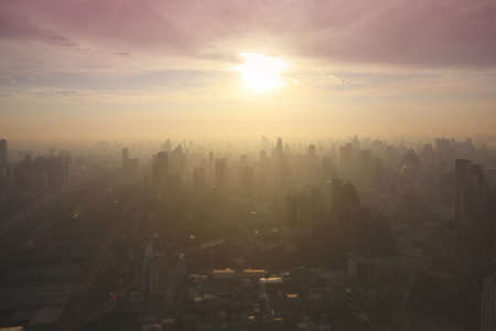 Air Pollution in the City, Morning sunrise, PM 2.5 fog and dust in a city crowded with buildings. This photo contain burry.の写真素材