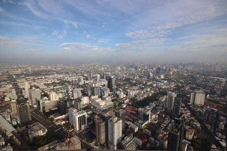 Air Pollution in the City, PM 2.5 fog and dust in a city crowded with buildings. This photo contain burry.の写真素材