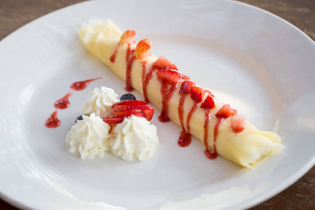 Strawberry Crepe cake crepe with berry on white dishの写真素材