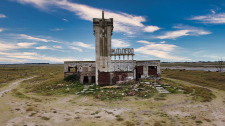 Old Epecuen slaughterhouse abandoned by flooding on a partly cloudy dayの写真素材