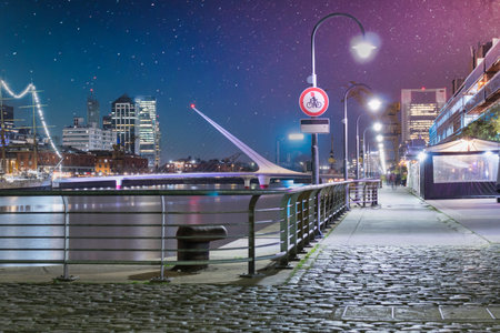 docks of puerto madero at night and cobbled street tourist destinationの写真素材