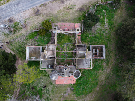 Aerial view of the abandoned ruins of the Friendship Castle in Chascomus at sunset surrounded by wild forestの写真素材