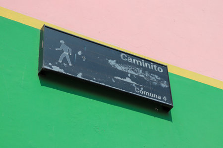 Old metal sign for the pedestrian street with a background of colorful wallsの写真素材