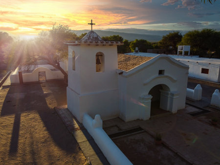 Drone photograph of San Pedro Church in Fiambala, Catamarca, painted white and glowing in the...