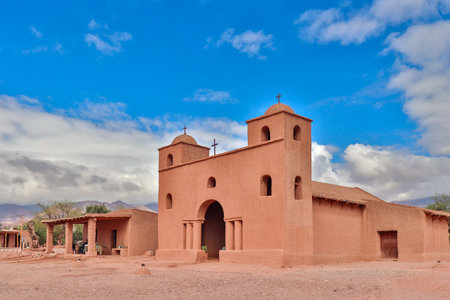Colonial adobe building with bell towers and arches at the Rosary Church. Located in Andacollo, Catamarca, Argentina, on the famous Adobe Route.の写真素材