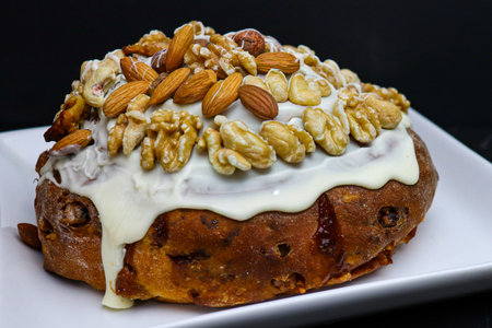 Artisanal and homemade Pan Dulce with sugary glaze and dried fruits, with dark food photography style. Holiday food and Christmas tradition.の写真素材