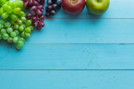 nature fruits set on blue wooden backgroundの写真素材