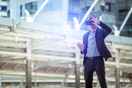 Caucasian play a VR simulation outdoor backgroundの写真素材