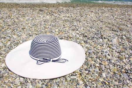 summer hat on a sunny beachの写真素材