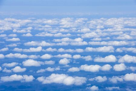 Bird's eye view of clouds and blue earth