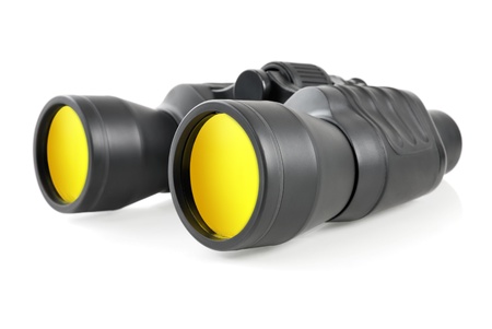 Studio shot of modern binoculars with yellow lenses on white background の写真素材