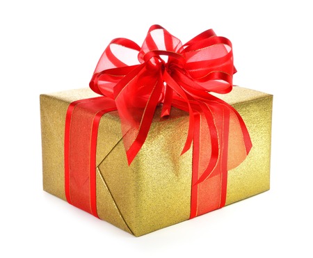 Gold gift box with red ribbon and a nice fancy bow, studio isolated on white backgroundの写真素材