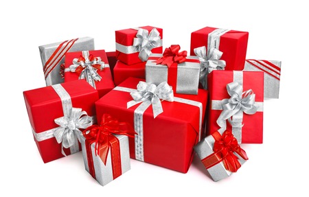 Fashionable pile of red and silver gift boxes with ornate bows, studio isolated on white backgroundの写真素材