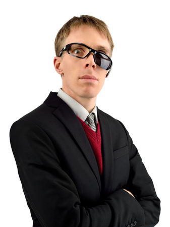 Freaky yet good-looking guy glaring through broken sunglasses, useable for many humorous concepts, isolated on whiteの写真素材