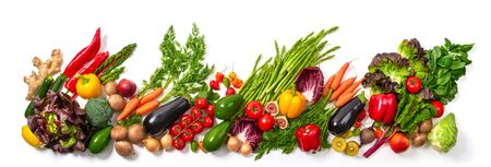 Arrangement of fruits and vegetables in many appetizing colors in a row, concept for a healthy plant-based lifestyle and fitness, wide formatの写真素材