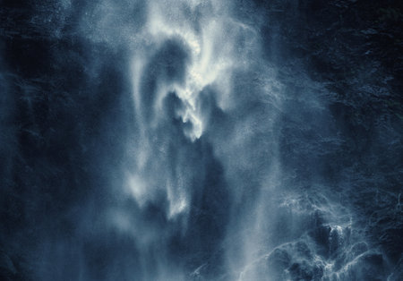 Part of a magnificent large waterfall as a dreamy, almost abstract high contrast image. White water...