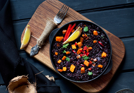 Black rice paella with pumpkinの写真素材