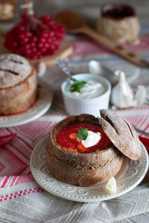 Traditional Ukrainian borscht in rye bread bowlの写真素材