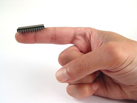 Electronic chip on fingerの写真素材