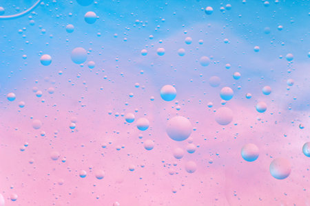 Design Creative Watery Texture of Blue and Pink Colors. Abstract Pastel Background of Oil Bubbles on...