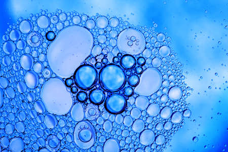 Abstract Bright Macro Photo of Blue Water Surface with Air Bubbles. Aquamarine Textural Background...