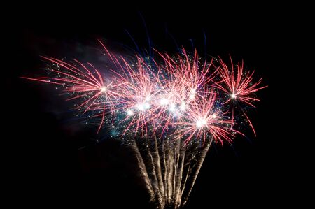 small palm shaped fireworks on black backgroundの写真素材