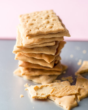 Stack of crackers on a light background.の写真素材