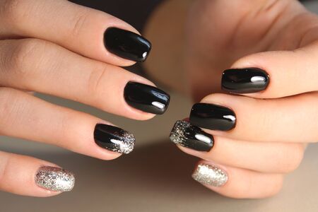 Evening manicure design in black and gold colorの写真素材