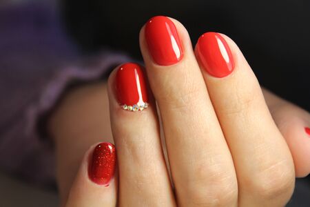 Youth manicure design gel varnish red colorの写真素材