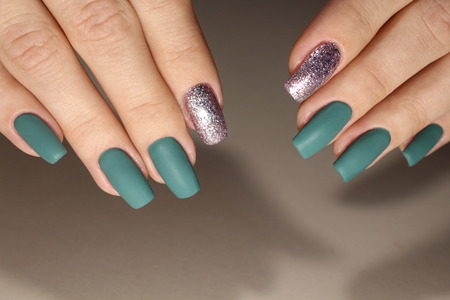 The design of the manicure is green with silver. Beautiful nails