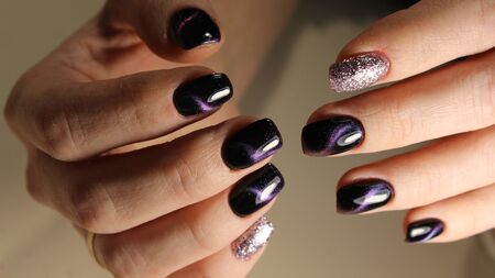 Close up on beautiful female hands with sexy manicure.