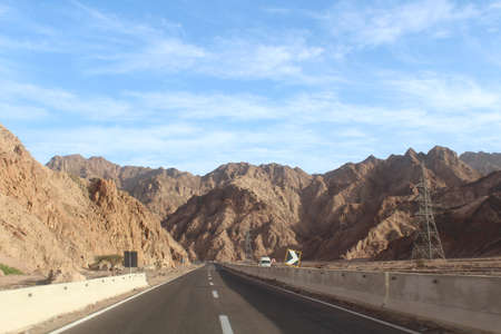 Mountain road at hight speed drive downhillの写真素材