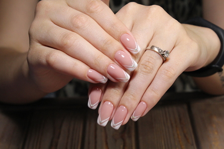 Hands with beautiful manicure. Natural nails with gel polishの写真素材
