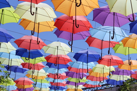 Palette of happiness. Colorful umbrellas background. Colourful umbrellas urban streetの写真素材