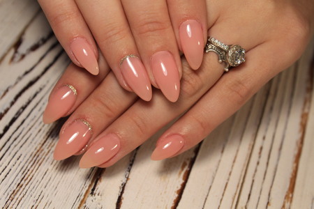 Close up on beautiful female hands with sexyの写真素材