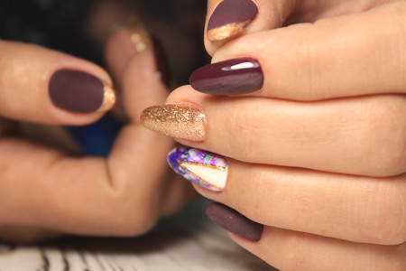 Women's hands with a stylish manicure.の写真素材