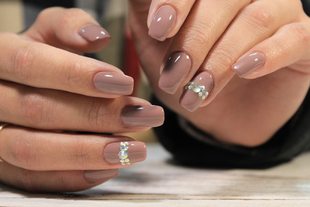 Amazing natural nails. Women's hands with clean manicure.
