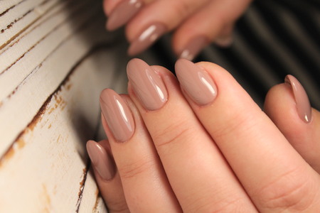 Sexual nail design on female hand close up.
