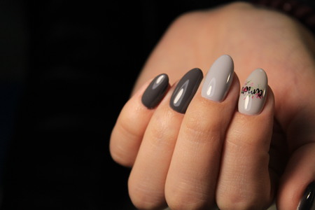 Manicure design nails varnish changes color.の写真素材