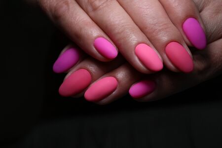 Beautiful groomed woman's hands on the light gray background.の写真素材