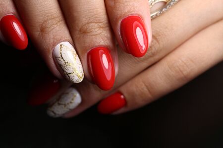 Beautiful groomed woman's hands on the light gray background.