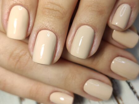 Hands Care. Hand With Pastel Nails In Sea Salt. Close Up Of Woman Hand With White Manicure In Pink...