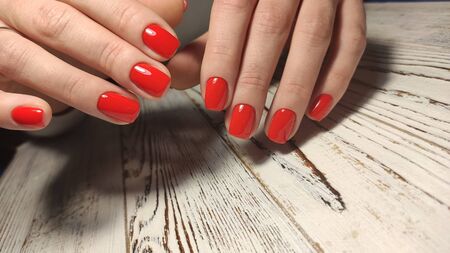Gray striped nail design on female hand close up 2019