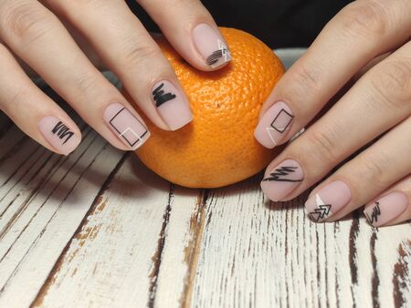 Gray striped nail design on female hand close up 2019の写真素材