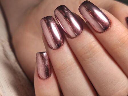 Trendy manicure design on a beautiful textural background.