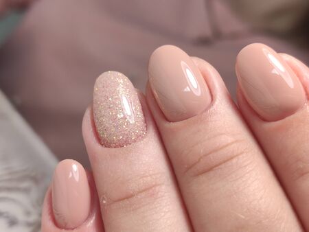 Amazing natural nails. Women's hands with clean manicure. Gel polish applied.
