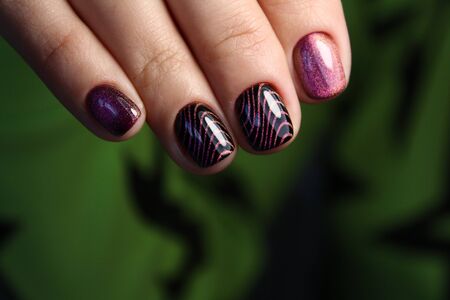 Trendy manicure design on a beautiful textural background.の写真素材